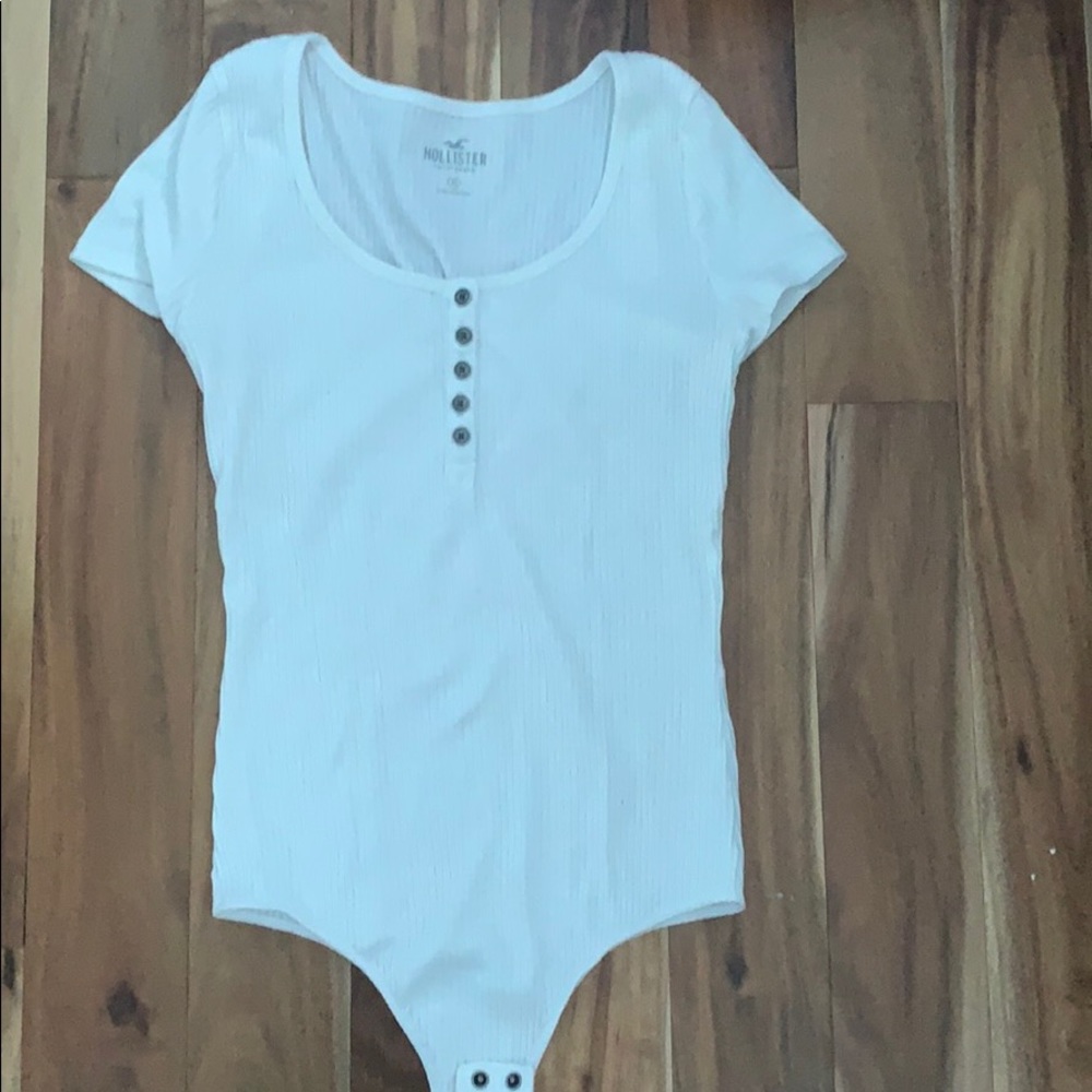 White short sleeved body suit.